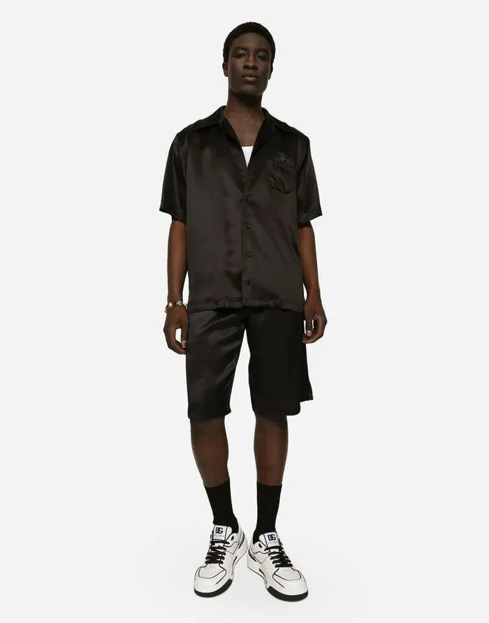 Dolce and Gabbana Trousers And Shorts Men Silk Satin Jogging Shorts With Metal DG Logo Black Dolce and Gabbana Trousers And Shorts Men Silk Satin Jogging Shorts With Metal DG Logo Black