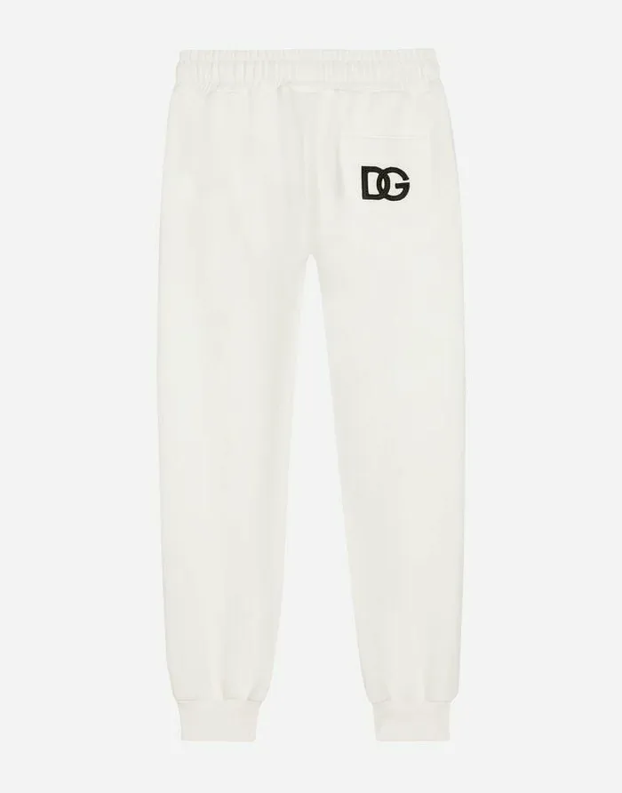 Dolce and Gabbana Trousers And Skirts Children Jersey Jogging Pants With DG Logo Patch White Dolce and Gabbana Trousers And Skirts Children Jersey Jogging Pants With DG Logo Patch White